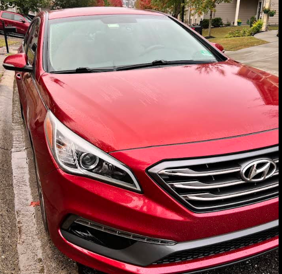 Red Hyundai sedan with restored premium paint finish